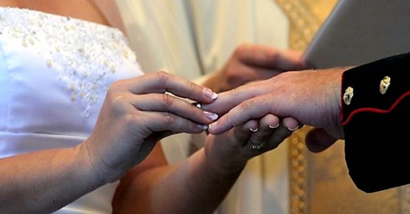 Man and woman exchanging rings during wedding