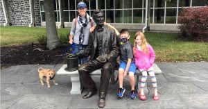 Family pose with Abraham Lincoln statue