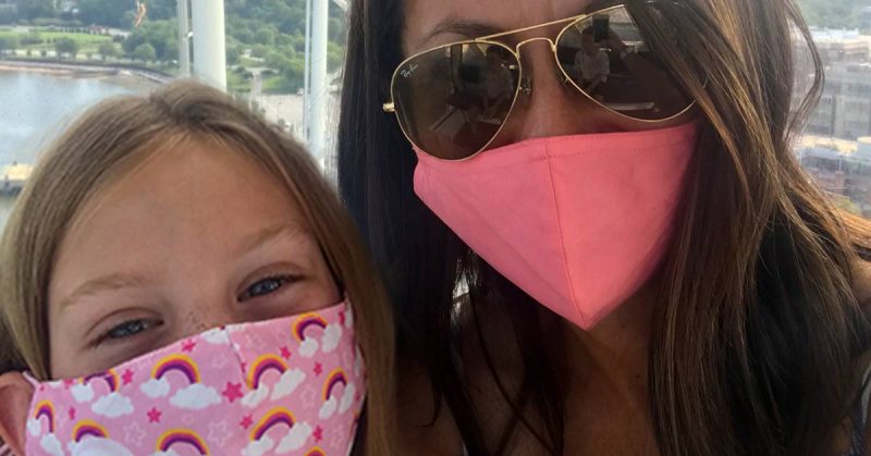 A mother and daughter wearing face masks