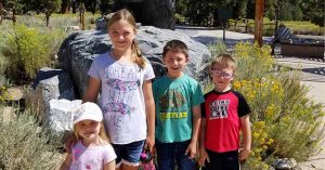 Lizann’s four children posing for a photo in Big Bear Lake.