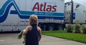 Kristi’s daughter looking at a moving truck