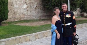 Lizann and her husband outside of a castle before the Marine Corps ball. 