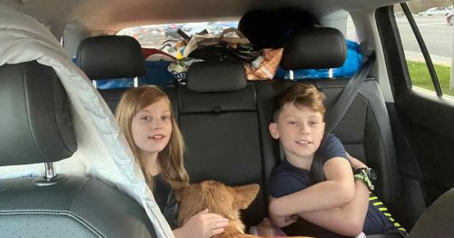 Packed car with Kristi’s kids and dog in the backseat