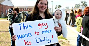 Lizann and her newborn son waiting to welcome home their service member.