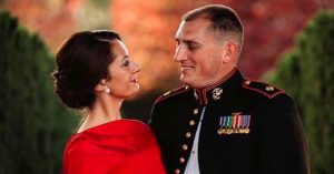 Kristi and her husband smiling at the Military Ball