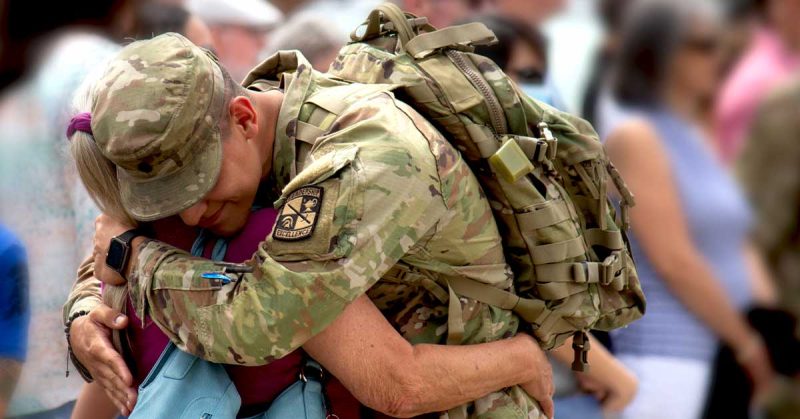 Service member hugging loved one