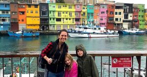 Kristi and her children and colorful buildings