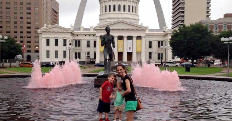 Kristi and her children in front of a fountain