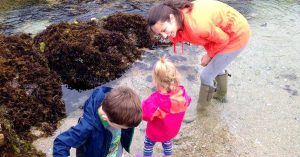 Kristi and her children playing in water