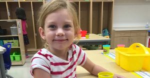 Krisit’s daughter smiling at school