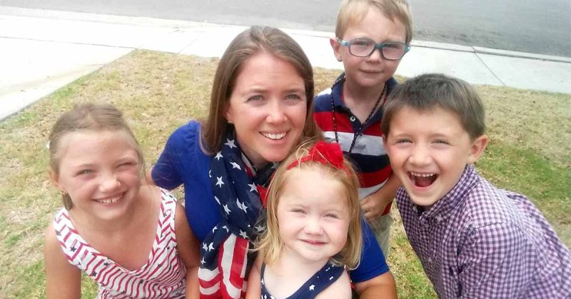 Lizann and her family smiling