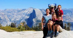 Lizann’s family in front of a mountain