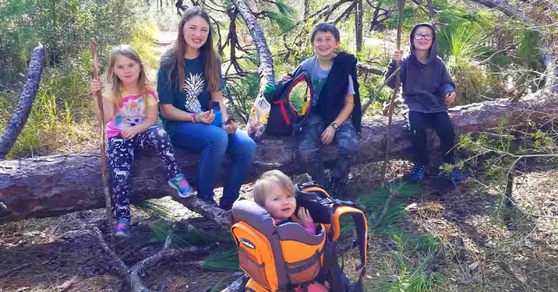 Lizann’s family sitting on a tree