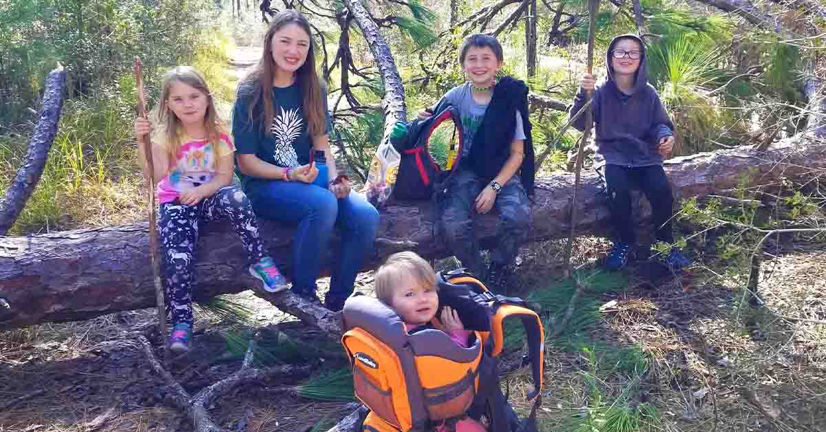 Lizann’s family sitting on a tree