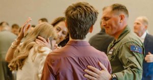 Kristi’s husband embraces family.