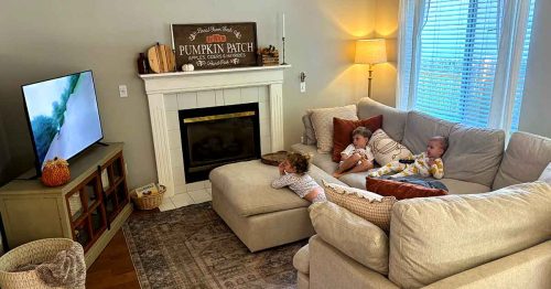 • Sydney’s children on the couch watching television
