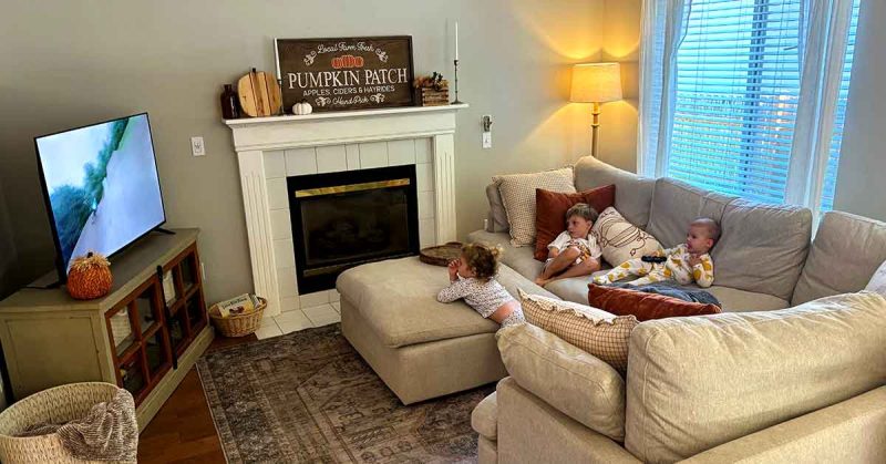• Sydney’s children on the couch watching television