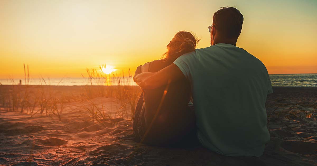 Couple sitting on beach together