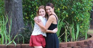 Kristi and her daughter hug