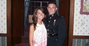 Kristi and her husband posing together indoors