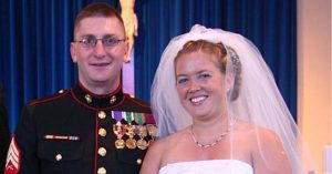 Lizann and her husband smile together at their wedding.
