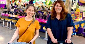 Lauren and her friend pushing strollers.