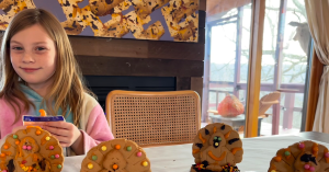 Kristi’s daughter making festive Thanksgiving cookies