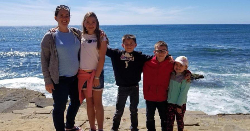 Lizann’s family in front of the ocean