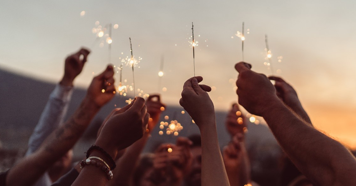 Friends celebrating with sparklers