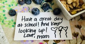 A notecard that says Have a Great Day at School! And Keep Looking Up! Love, Mom