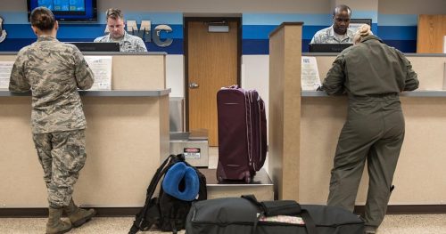 Service members checking in at the airport