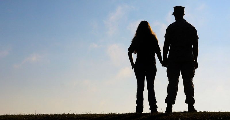 silhouette of military couple